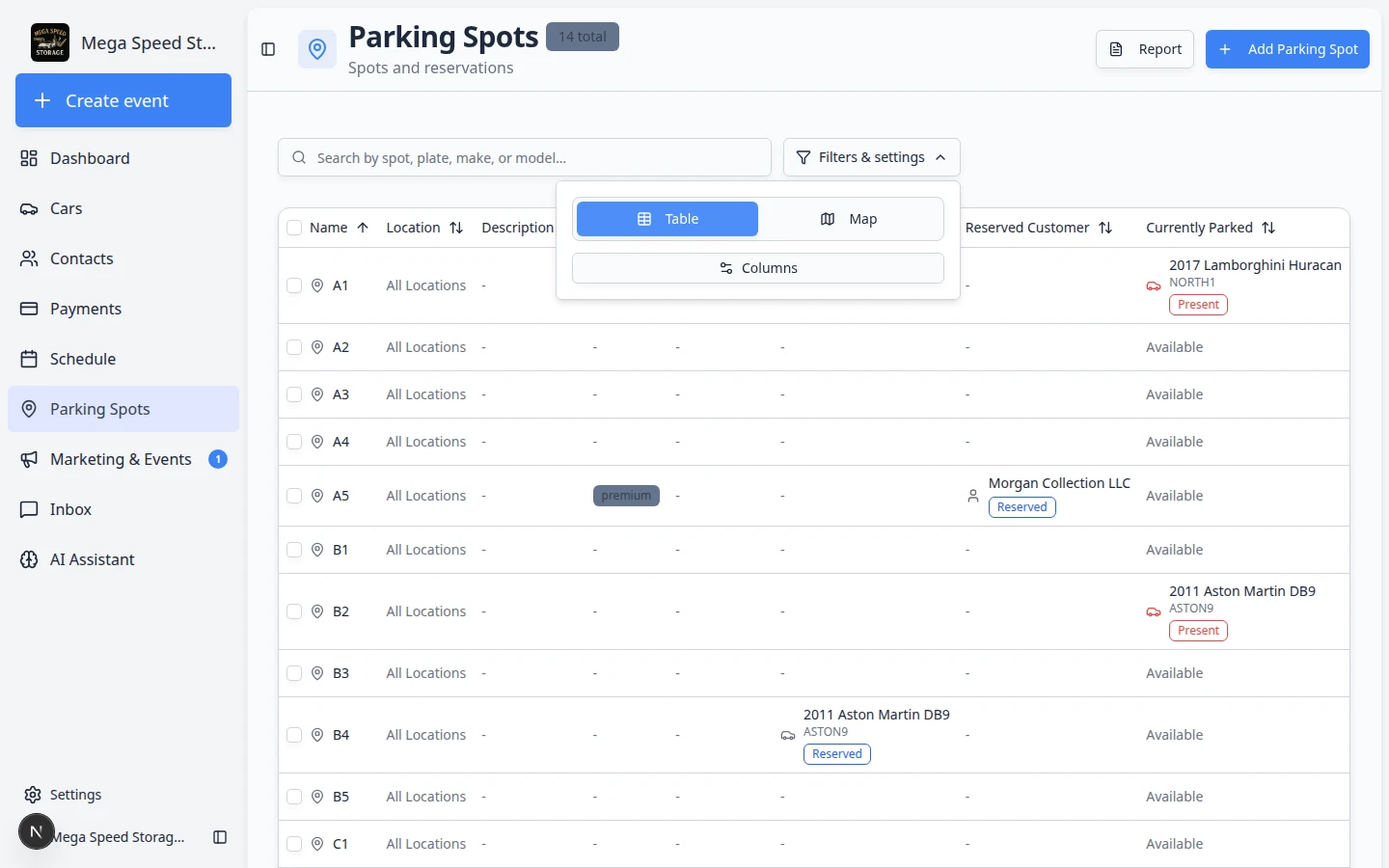 Parking Spots table view showing spot names, reserved cars, currently parked vehicles, and status columns
